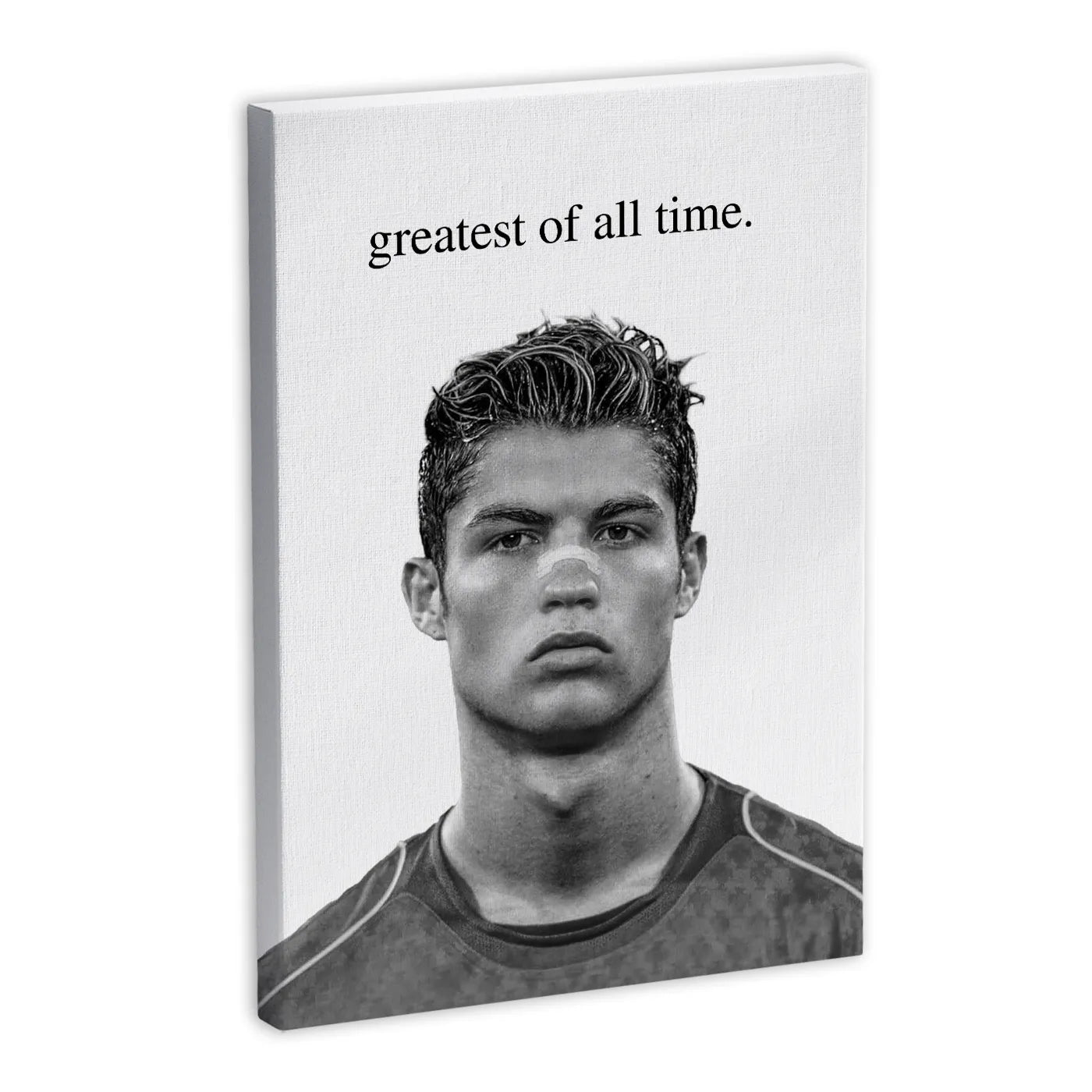 Czarno-biały portret piłkarza z napisem "greatest of all time" na płótnie.