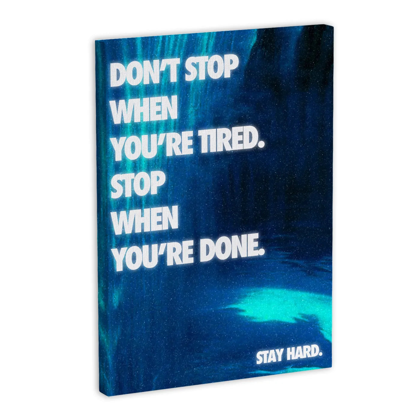 Motywacyjny obraz na płótnie z napisem "DON'T STOP WHEN YOU'RE TIRED. STOP WHEN YOU'RE DONE." na tle w odcieniach niebieskiego.